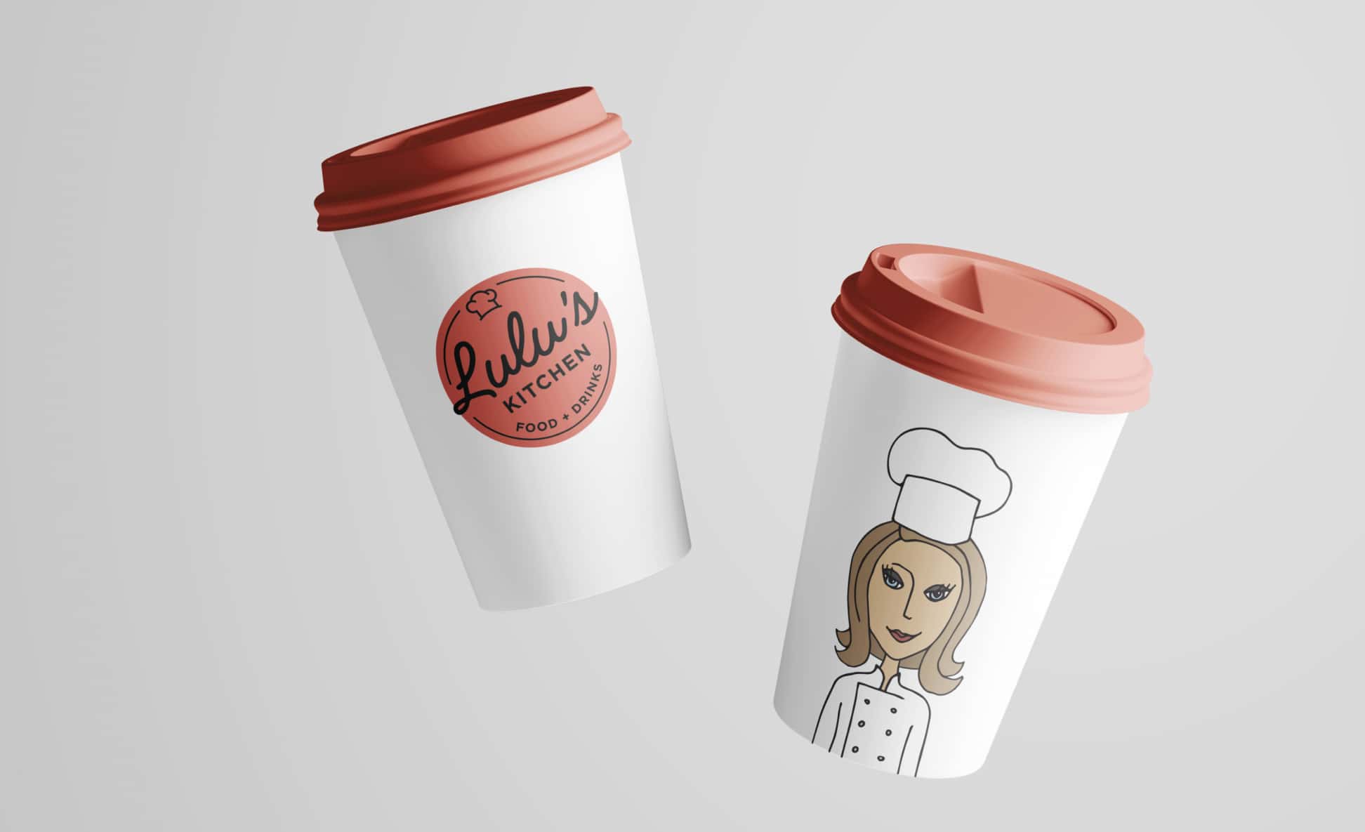 Two disposable coffee cups with lids, one featuring the logo of Lulu's Kitchen and the other adorned with an illustration of a female chef, representing the brand's identity.